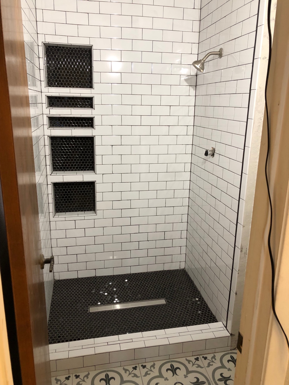 Shower with white tile